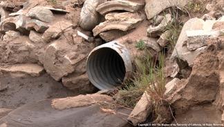 Fig. 3. Corrugated metal culvert drain pipe. Culverts provide cross drainage for roads with inside ditches. Photo: R. Lucas.